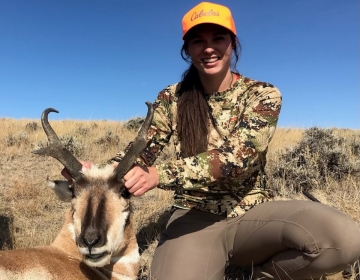 A female hunter with posing with her pronghorn antelope