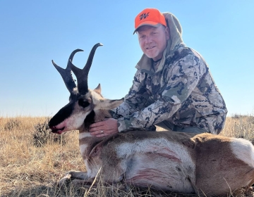 A pronghorn antelope harvested in Wyoming is displayed by a satisfied hunter after a guided hunt with SNS Outfitter & Guides.